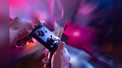 gamer playing game by joystick with computer, gaming and esports challenge, streaming online, tournament concept, player with console controller in cyberpunk room