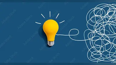 Clarifying complex ideas theme with light bulb – Flat lay